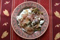 Grilled chicory, raw ham and goat cheese