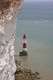 Beachy Head lighthouse dwarfed by the towering white cliffs