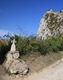 Foreground cross, background chateau of Roquefixade.