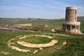 Clavell Tower behind its original foundations at the cliff's edge